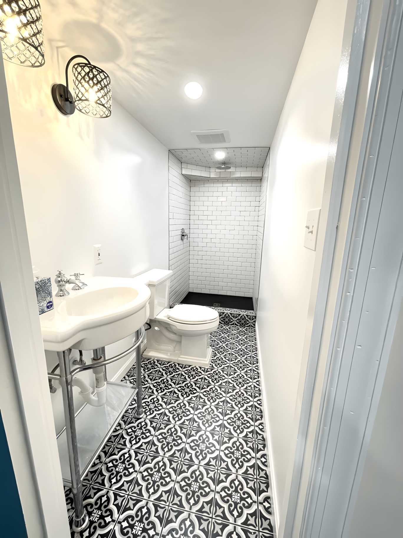 Completed bathroom remodel with tiled walk-in shower